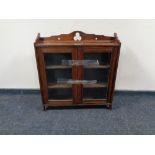 An Edwardian mahogany Arts and Crafts wall cabinet