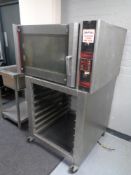 A Cuisine De France stainless steel commercial oven, width 98 cm, on trolley.