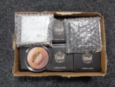 A box containing Cougar by Paula Dunne eye shadow palettes (new).