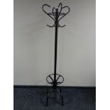 A contemporary metal hat and coat stand together with a painted linen box