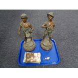 A tray containing a pair of antique Spelter figures on wooden stands,