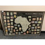 A colour print depicting the story of Africa in stamps, 92 x 62 cm, framed.