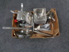 A box containing commercial kitchenalia to include scales, two can openers, milk jug,