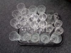 A tray containing assorted drinking glasses.