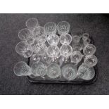 A tray containing assorted drinking glasses.