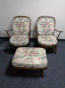 A pair of Ercol elm and beech armchairs with matching footstool together with one further Ercol