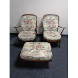 A pair of Ercol elm and beech armchairs with matching footstool together with one further Ercol