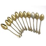 Eleven silver gilt spoons, 84g.