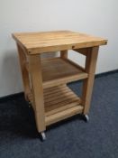 A pine butcher's block trolley on castors