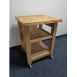 A pine butcher's block trolley on castors