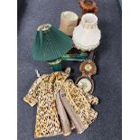 A box containing assorted table lamps, glass shades, contemporary barometer, a cheetah print coat.