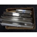 A box containing 13 stainless steel kitchen cabinet door handles (new).