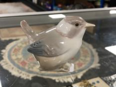 A Lladro figure of a bird.