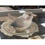 A Lladro figure of a bird.