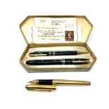 A boxed pen and pencil set with original receipt from 1956 and a 14ct gold filled Parker with 14ct