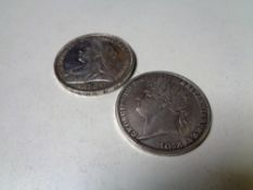 Two silver crowns, 1821 and 1897.