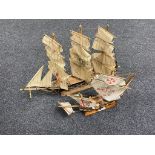 Two wooden models of three masted ships.