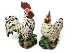 Two old French pottery figures modelled as a hen and cockerel, height 32 cm.