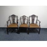 A set of six 19th century shield back dining chairs comprising of two carvers and four singles.