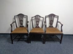 A set of six 19th century shield back dining chairs comprising of two carvers and four singles.