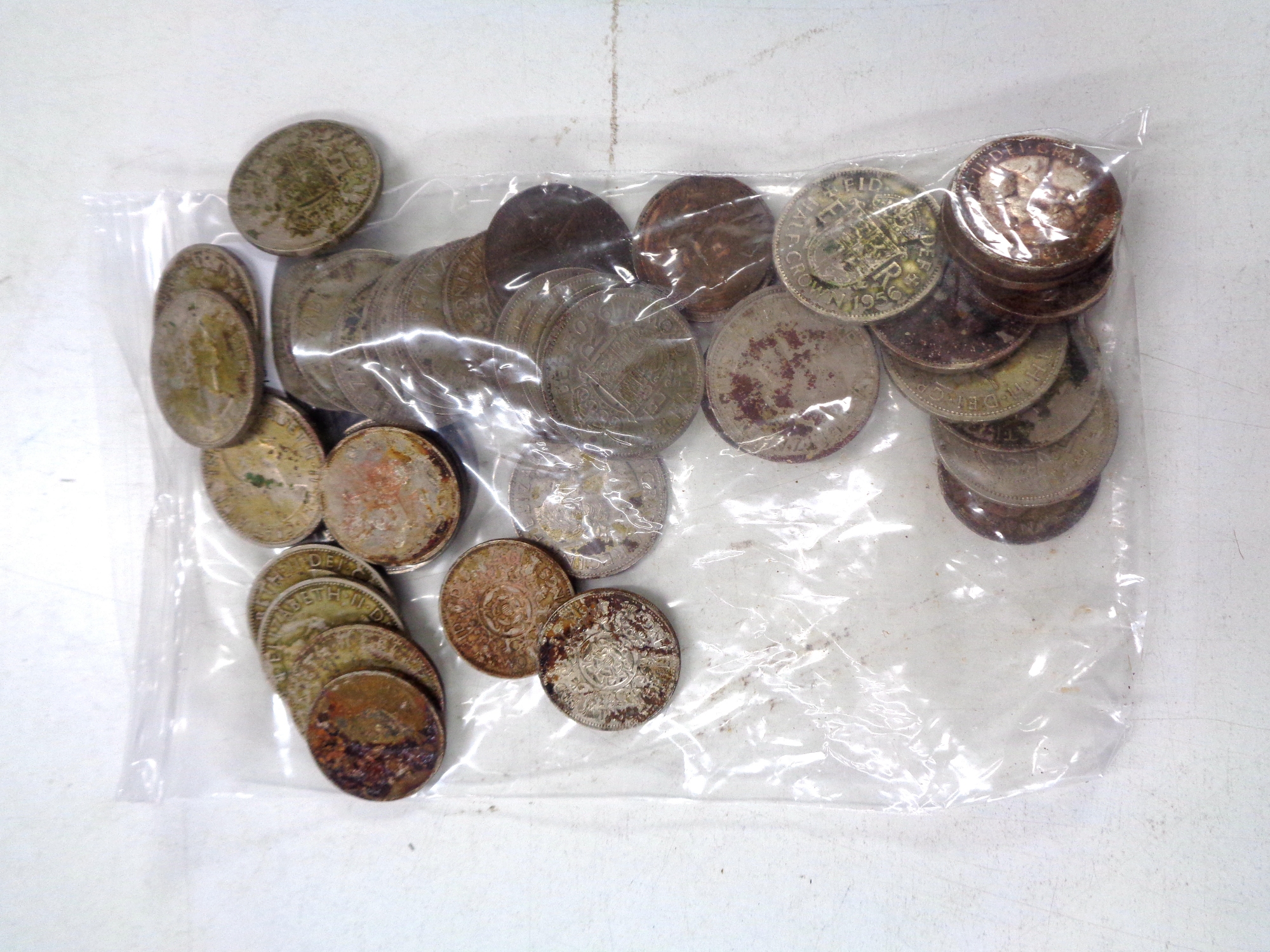 A small quantity of mid century coins, mostly British, half crowns etc.