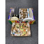 Two boxes containing continental figures, assorted glassware, boxed Chinese chopsticks and dishes.