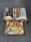 Two boxes containing continental figures, assorted glassware, boxed Chinese chopsticks and dishes.