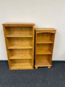 Two sets of pine open bookshelves.