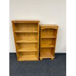 Two sets of pine open bookshelves.