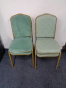 Two pairs of metal framed stacking banqueting chairs