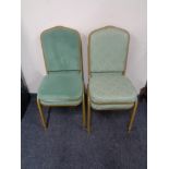 Two pairs of metal framed stacking banqueting chairs