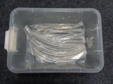 A box containing 27 stainless steel kitchen cabinet door handles (new).