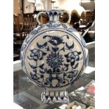 A middle eastern glazed pottery blue and white moon flask vase (a/f)