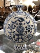 A middle eastern glazed pottery blue and white moon flask vase (a/f)