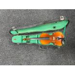 A Chinese violin and bow in case.