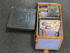 A BSR Belt drive turntable together with a wicker picnic basket containing a quantity of LPs to