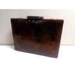 An Amiet crocodile leather briefcase.