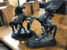 A pair of antique Spelter figures of rearing horses.