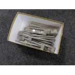 A box containing 17 stainless steel kitchen cabinet door handles (new).