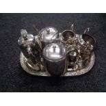 A 20th century oval plated tray containing six pieces of plated tea ware.