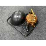 A tray containing antique cast iron flat iron, a brass and copper kettle,