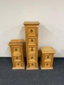 A narrow Mexican pine five drawer chest together with matching three drawer and two drawer chests.