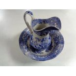 An antique blue and white wash jug with basin.