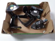 A box of two antique hand painted cobblers lasts together with two similar irons