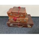 Three 20th century leather cases together with a leather bound photograph album