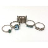 Five silver gem set dress rings.