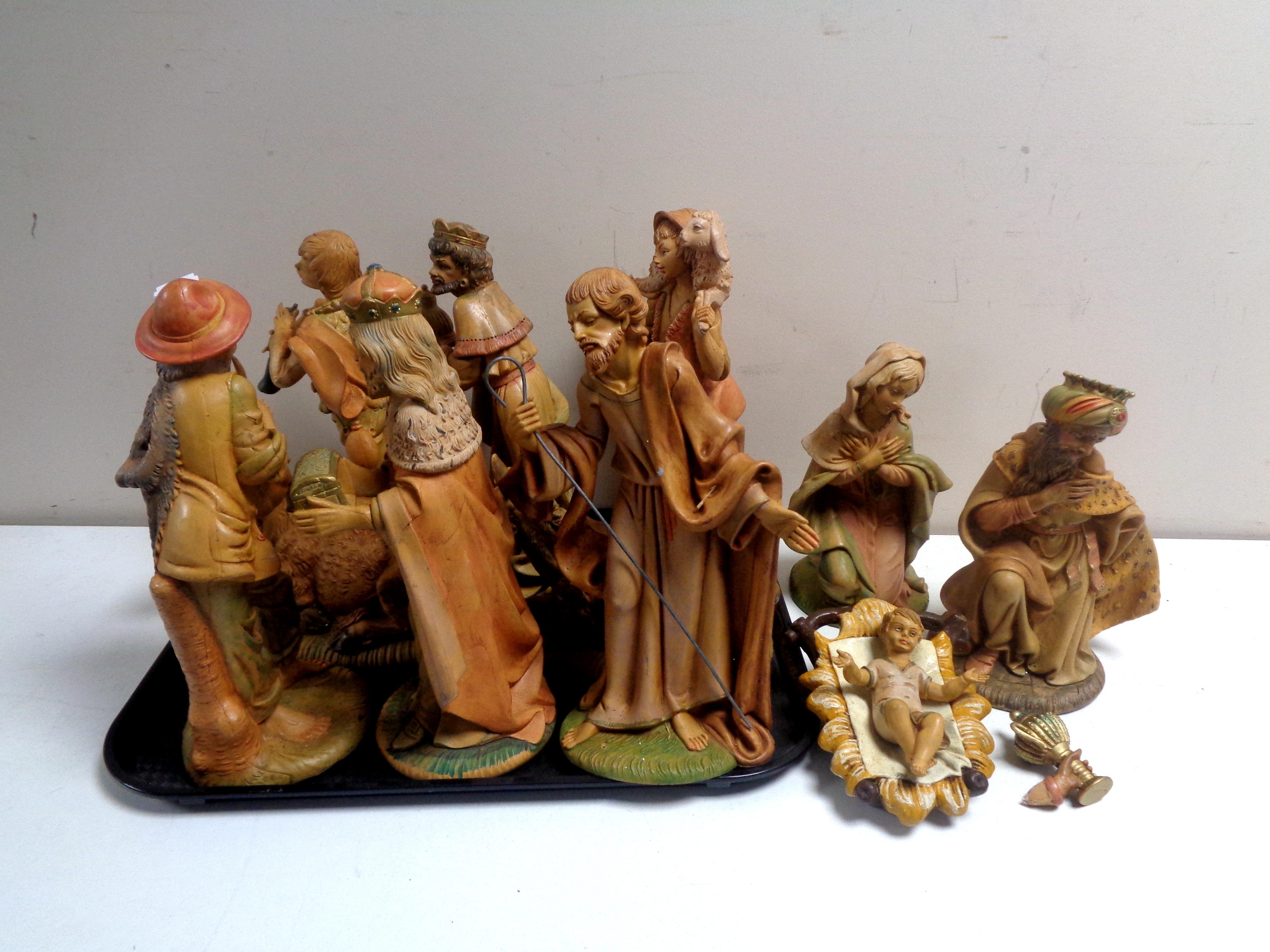 A tray containing an 11 piece 20th century plastic nativity set (as found).