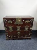 A Korean storage chest with brass mounts and handles