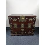 A Korean storage chest with brass mounts and handles