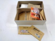 Two boxes of loose stamps, World and GB.